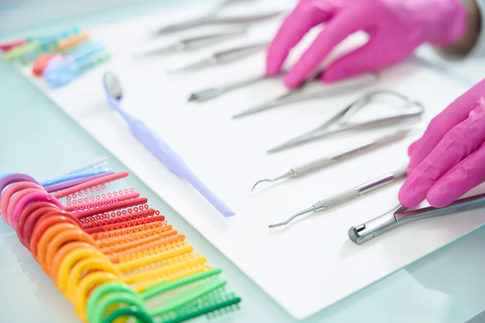 Small dental supply items and accessories arranged for review